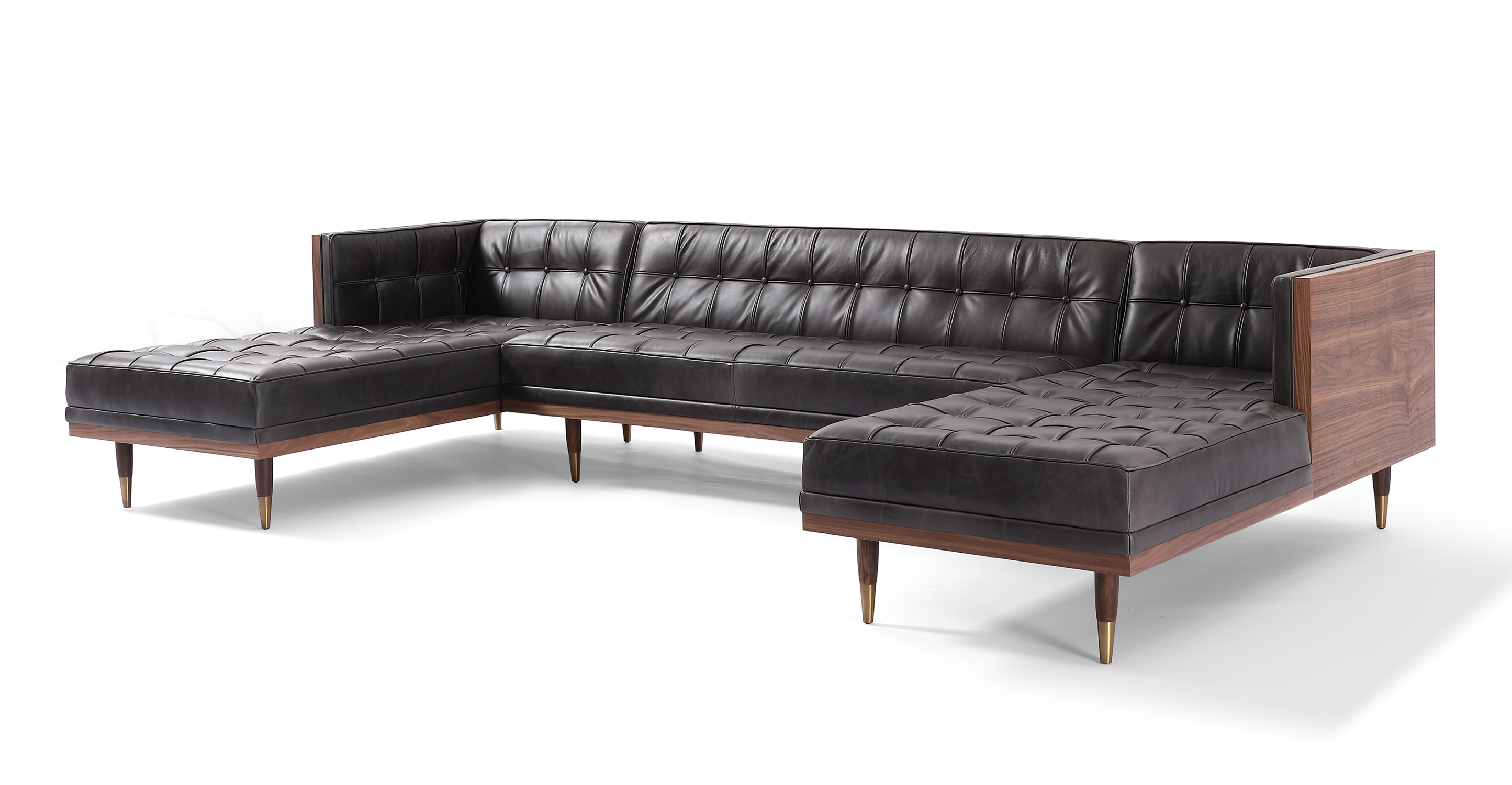 Woodrow U Sectional in Saddle leather Black has fixed seat and back cushions. There is a left chaise, a middle armless loveseat, and a right chaise. There is button tufting on the back cushion, sides of the sofa and on the seat cushions. The frame and legs are walnut wood toned. The legs have brass colored ferrules on the ends. The back and outsides of the sectional are wooden. The upholstery color is black.